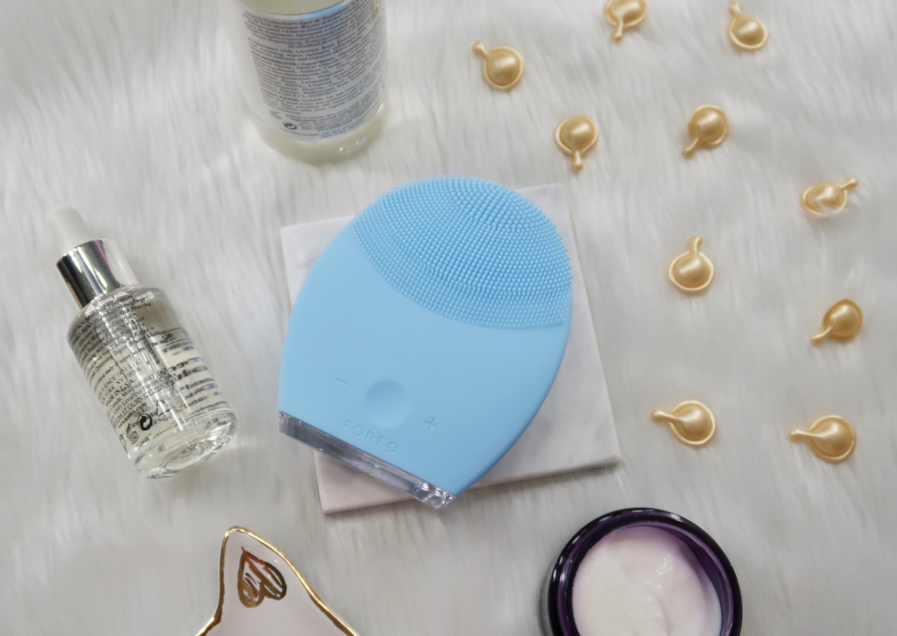 Skin care devices are becoming an in thing nowadays; for facial cleansing, it started with Clarisonic and it became the benchmark for mechanical facial brushes that followed. In 2013, Swedish beauty device brand, Foreo opened to the world and released their first product, The Luna. In one of her Instagram stories, Kim Kardashian did a skin care splurge and one of her purchases is a lavender Foreo Luna 2; she then posted a follow up story professing that it's a favorite of hers. We could pretty much assume that it propelled Foreo to stardom and since then, it's been making waves and increasingly becoming a skin care staple of many skin care enthusiasts! I never rode the Clarisonic Wave because the reviews have been mixed ever since its launch; I didn't want to spend a fortune only to find out that I'm on the unfavored side. Besides, I found cheaper mechanical brush alternatives that worked just fine. When I learned about Foreo, I've been very curious and lusting over it because it's a much gentler alternative! Finally, I have it and after using it for 2 months, I'm ready to give my thoughts! Foreo is a beauty and tech company specializing in cleansing devices for the face and teeth made with their signature material, silicone. Foreo Luna is a line of mechanical facial brushes made with medical grade silicone that's safe even for sensitive skin and hygienic; the technology featured in the brushes is called T-Sonic Pulsations that provide a deep cleaning, anti- wrinkle, and massaging effect. The other Foreo face brush variants available are: Luna Mini 2- good for travel and a smaller version of Lune 2; has bristles on both sides--one side is for customized cleansing and the other side for deep cleansing. Luna UFO- a masking device using thermal and cryo therapy that activate the benefits of sheet masks; must be used with an exclusive Foreo mask. Luna Go (for men)- good for the bag; made for men; bears the features of Luna 2. A box of Luna 2 is comprised of the gadget, a charging USB cord, warranty card and manual, velvet pouch, and a silicone tab, which I think is a resting pad for the device. Let's break down the anatomy of Luna 2. Here's the cleansing side; it tapers from bottom to top with the largest bristles concentrated on the tip; the reason behind this it lets the device reach corners and clean them better. There's a Luna 2 for every skin type: combination, sensitive, normal, oily. The blue one I have is for combination skin. Just in case you're wondering, the bristle configuration isn't uniform on all devices! The reason behind the difference in the bristle configuration is each brush is meant to provide a customized clean: sensitive skin brush has finer, smaller bristles, normal skin brush has a mix of small and medium bristles, combination brush has small, medium, and large bristles, and oily brush has large bristles, not to mention square- shaped too to dislodge oil build- up effectively. The back side has grooves; this is the anti-aging massage portion and it's meant for use after washing; it's meant to stimulate the skin, loosen up the pores, and drive skin care in so you can maximize it more. The shape of Luna 2 is quite intuitive; I can grip on it easily and comfortably, it's light, feels solid, and material is quite easy to clean and dries up easily too. Foreo Luna 2 must be charged for at least 1- 2 hours before usage. One single charge can last up to 450 uses or about a year! Also, Foreo is made to be used in the shower so don't worry about electrocution or anything like that because it's waterproof, but still, follow the safety instructions. What's T-Sonic Pulsation, you ask? It's a savvy, new way to remove dirt inside pores and debris on the surface. Foreo Luna 2 delivers 2x the T-Sonic power (I suppose this is compared to the first Luna) at 8,000 pulses per minute. I call this shakefoliation. It's supposedly gentle because the brush head is made with gentle silicone material. HOW TO USE FOREO There are three buttons on Luna 2: the middle is the power button and - is the decrease frequency button and + is the increase frequency button. There are about 8 modes to this; I normally use frequency three only for cleansing and frequency one for the massage; the low frequency is great for massaging and stimulating the skin, according to Foreo. To turn the device on and off, give the power button a single press. To pause your routine, press the power button once in the middle of your routine and press again when you're ready to resume. There's a light indicator at the bottom of the device that lights up when it's on pause and disappears when you turn it off or when your session is over. How long should you use Foreo? 1 minute for cleansing and 1 minute for the massage; it's a 2-minute routine. There's no time indicator, but the device is programmed to deliver only 1 minute cleansing and massage every time you use it. I've been using this device for 2 months and here's my result: This is a photo after my initial use. We all know how hard it is to get rid of blackheads from your pores; it's those tiny little black monsters lurking in the deep and giving your skin a rough, dirty appearance. I used Foreo Luna 2 for the first time and spent quite a bit of time on my nose area and holy cow, look! Normally, I would need to use a nose strip to remove lodged dirt, but T-Sonic pulsations did the job for me! I must say, I'm impressed the first time! Some things I noticed in my journey: 1. After running the device all over my face for a minute, I noticed that some fresh zits would show up the white eye immediately, which is what you pop to get rid of the zit completely. Good for me because I don't have to wait for days to get rid of the zit, although I don't know if there's any dermatological merit to the effect. 2. Zits with the white eye showing would burst when I run the device on them, which saves me from painful pricking. Now I would just have to clean the zits with skin care after the routine. Easy peasy! 3. The anti-aging massager is very relaxing; a great way to end the night and I like how it drives skin care into my skin without me having to use my hands. 4. The device is very easy to clean after every use. Dries up with a pat of a towel and stores easily too. It's been two months and I still enjoy using Foreo Luna 2. I thought I would break out because I'm using it everyday, but no, I did not (except for some crazy hormonal acne). It is because the bristles are very gentle and I can customize cleansing to the frequency that I prefer. My face feels cleaner every single time and my toning pad would show less dirt compared to my pre-Foreo routine; that goes to show that it cleans the skin really well. I also like the fact that it forces me to clean my skin for a minute, which is probably the time I need to spend to make sure that I'm cleaning my face really well; after using Foreo, I realized, I haven't been washing my skin properly and well, plus it's a well- designed device. This device was sent to me by Foreo; just to throw a bit of transparency there. But after using the device, I can say now that even if it wasn't sent to me, I would buy it simply because it works. I actually think I will get Luna Mini 2 for traveling! If you're thinking of buying a Foreo, I'd say it's a good investment, most especially if you're a commuter, you wear heavy makeup all the time, and even if you're just a skin care junkie. Good thing there's Luna Mini 2 to ease your way into the world of Foreo!